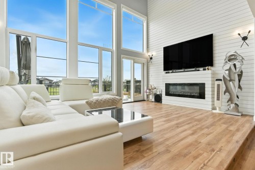 1048 Goldfinch Way, Edmonton, AB - Indoor Photo Showing Living Room With Fireplace