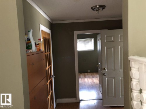 Interior hallway with light olive-painted walls and white trim - 11507 141 Avenue, Edmonton, AB - Indoor Photo Showing Other Room