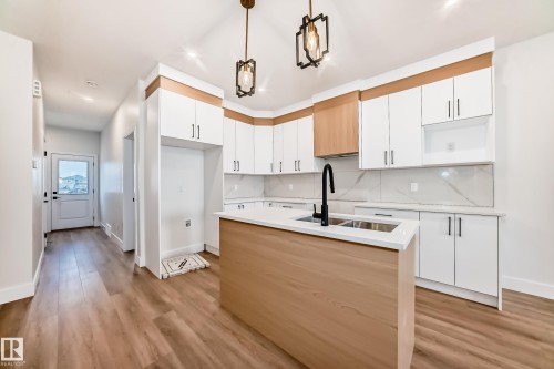 100 Elliott Wynd, Fort Saskatchewan, AB - Indoor Photo Showing Kitchen With Double Sink