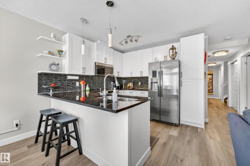 109 5151 Windermere Boulevard, Edmonton, AB - Indoor Photo Showing Kitchen With Double Sink With Upgraded Kitchen