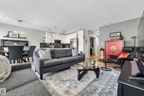 109 5151 Windermere Boulevard, Edmonton, AB - Indoor Photo Showing Living Room
