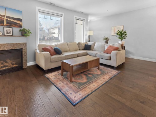#13 11518 76 Av Nw, Edmonton, AB - Indoor Photo Showing Living Room With Fireplace