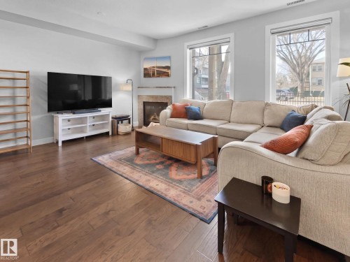 #13 11518 76 Av Nw, Edmonton, AB - Indoor Photo Showing Living Room With Fireplace