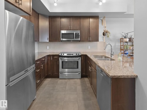 #13 11518 76 Av Nw, Edmonton, AB - Indoor Photo Showing Kitchen With Stainless Steel Kitchen With Double Sink With Upgraded Kitchen