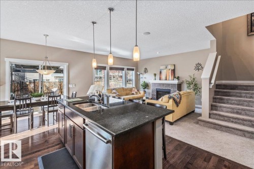 2108 77 Street, Edmonton, AB - Indoor Photo Showing Kitchen With Fireplace With Double Sink With Upgraded Kitchen