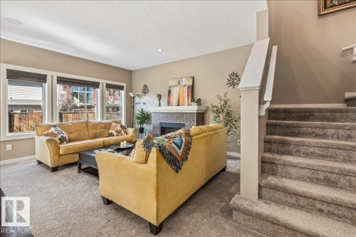 2108 77 Street, Edmonton, AB - Indoor Photo Showing Living Room With Fireplace