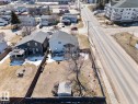 Property featuring a fenced backyard with a gazebo, patio space, and a circular fire pit area - 1414 7 Avenue, Cold Lake, AB  - Outdoor With View 