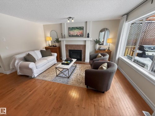 15 Spring Link, Spruce Grove, AB - Indoor Photo Showing Living Room With Fireplace