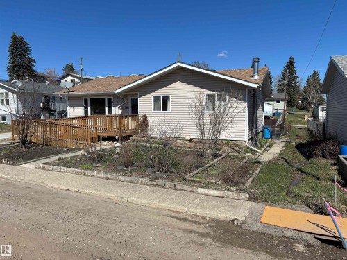 Light-colored siding exterior with a brown shingle roof - 4824 49 Avenue, Sangudo, AB - Outdoor