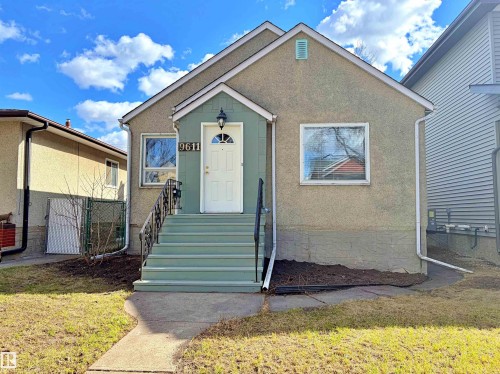 Stucco-clad bungalow with a light-colored exterior and contrasting green trim - 9611 81 Avenue, Edmonton, AB - Outdoor With Exterior
