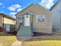 Stucco-clad bungalow with a light-colored exterior and contrasting green trim - 9611 81 Avenue, Edmonton, AB  - Outdoor With Exterior 