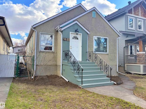 Stucco exterior with a peaked roofline - 9611 81 Avenue, Edmonton, AB - Outdoor