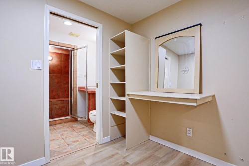 Built-in shelving and vanity with mirror - 9611 81 Avenue, Edmonton, AB - Indoor