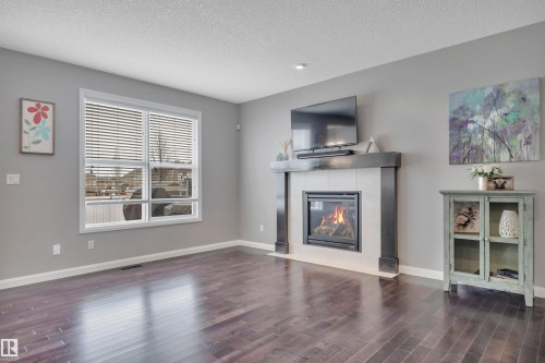 287 Sheppard Circle, Leduc, AB - Indoor Photo Showing Living Room With Fireplace