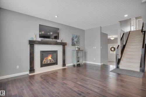 287 Sheppard Circle, Leduc, AB - Indoor Photo Showing Living Room With Fireplace