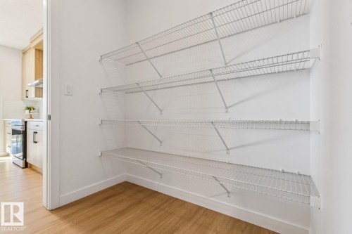 Kitchen pantry featuring white wire shelving across two walls - 39 Caledon Crescent, Spruce Grove, AB - Indoor With Storage