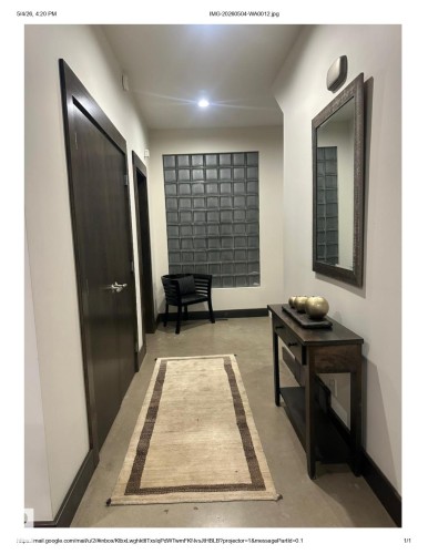 Hallway featuring concrete flooring and a glass block window - 9012 98 Street, Edmonton, AB -  Photo Showing Other Room