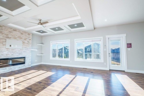 4408 39 Street, Beaumont, AB - Indoor Photo Showing Other Room With Fireplace