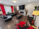 23 Dillworth Crescent, Spruce Grove, AB  - Indoor Photo Showing Living Room With Fireplace 