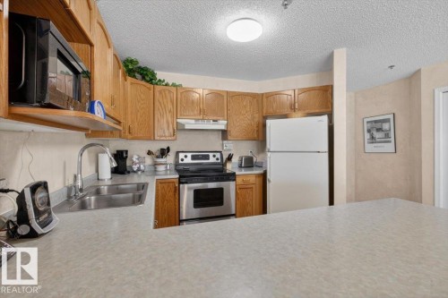 105 5212 25 Avenue Nw, Edmonton, AB - Indoor Photo Showing Kitchen With Double Sink