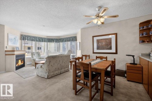 105 5212 25 Avenue Nw, Edmonton, AB - Indoor Photo Showing Other Room With Fireplace