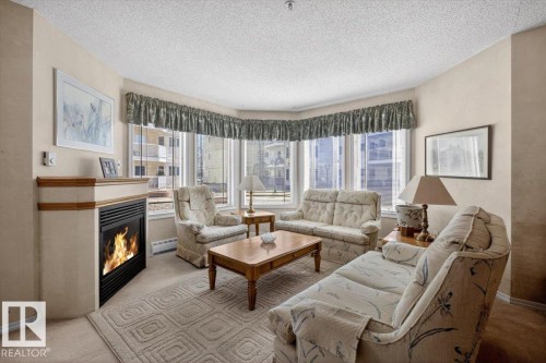 105 5212 25 Avenue Nw, Edmonton, AB - Indoor Photo Showing Living Room With Fireplace