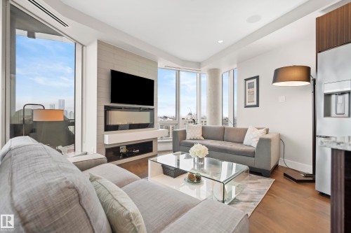 1901 11969 Jasper Avenue, Edmonton, AB - Indoor Photo Showing Living Room With Fireplace