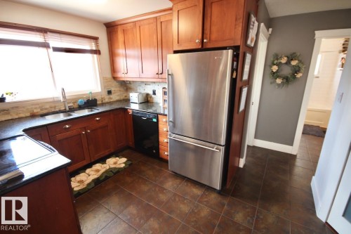 8607 35A Avenue, Edmonton, AB - Indoor Photo Showing Kitchen With Double Sink