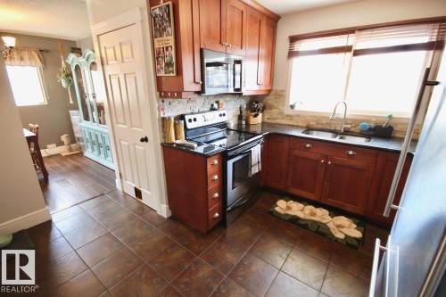 8607 35A Avenue, Edmonton, AB - Indoor Photo Showing Kitchen With Double Sink