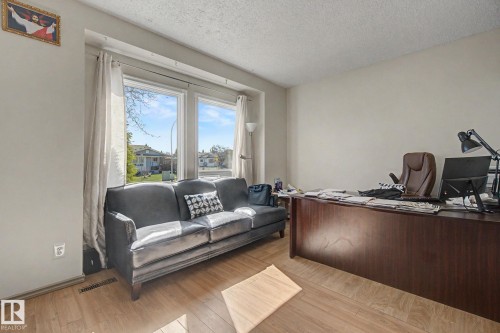 Spacious room with light wood-finish flooring and neutral wall tones - 4106 38 Street, Edmonton, AB - Indoor Photo Showing Office