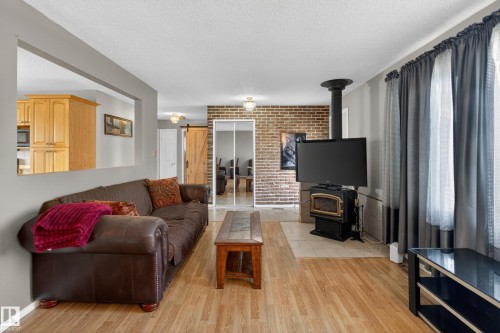 47 Duke Drive, Lamont, AB - Indoor Photo Showing Living Room With Fireplace