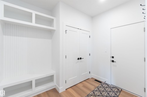 Built-in hall tree with beadboard backing, overhead shelving, and integrated bench storage - 74 Eldridge Point(E), St. Albert, AB - Indoor Photo Showing Other Room