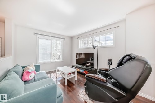 Bright living space with rich wood-finish flooring - 45 4850 Terwillegar Common, Edmonton, AB - Indoor