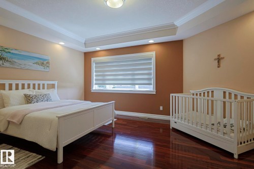 Tray ceiling with recessed lighting - 10731 150 Street Nw, Edmonton, AB - Indoor Photo Showing Bedroom