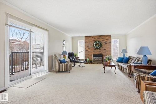 10667 65 Street, Edmonton, AB - Indoor Photo Showing Living Room With Fireplace