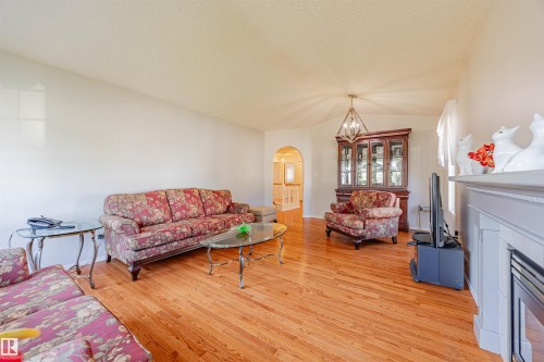 128 215 Blackburn East Drive, Edmonton, AB - Indoor Photo Showing Living Room With Fireplace