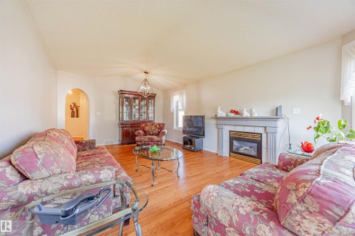 128 215 Blackburn East Drive, Edmonton, AB - Indoor Photo Showing Living Room With Fireplace