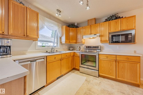 128 215 Blackburn East Drive, Edmonton, AB - Indoor Photo Showing Kitchen With Stainless Steel Kitchen With Double Sink