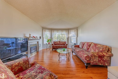 128 215 Blackburn East Drive, Edmonton, AB - Indoor Photo Showing Living Room With Fireplace