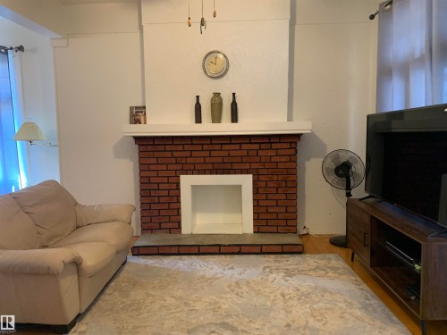 11305 89 Street, Edmonton, AB - Indoor Photo Showing Living Room With Fireplace
