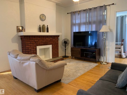 11305 89 Street, Edmonton, AB - Indoor Photo Showing Living Room With Fireplace