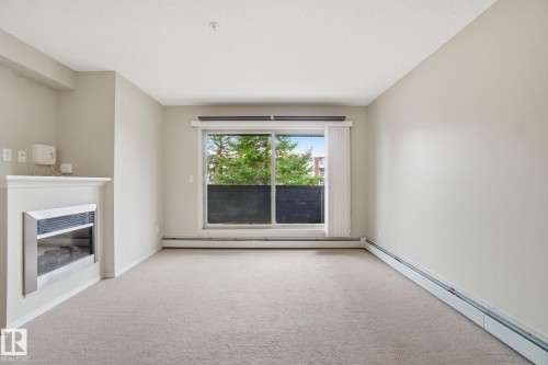 214 17011 67 Avenue, Edmonton, AB - Indoor Photo Showing Other Room With Fireplace