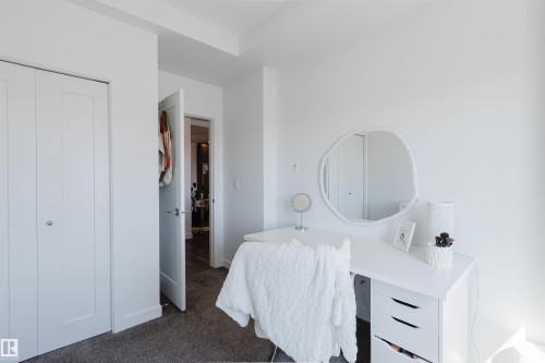 Interior space featuring white walls and grey carpet flooring - 316 1316 Windermere Way, Edmonton, AB - Indoor Photo Showing Bedroom