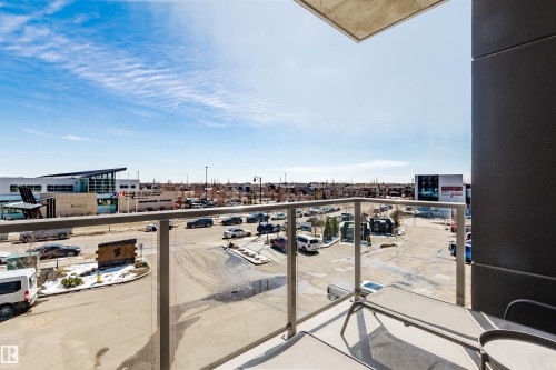 Private balcony featuring glass railings and a concrete ceiling - 316 1316 Windermere Way, Edmonton, AB - Outdoor With Balcony With View