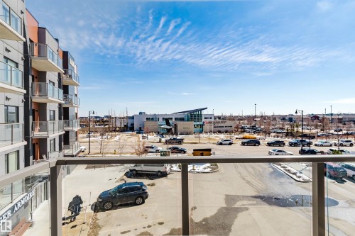 Balcony featuring glass and metal railings - 316 1316 Windermere Way, Edmonton, AB - Outdoor With Balcony