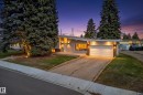 Mid-century modern residence featuring a pitched roofline, attached garage, and exterior sconce lighting - 5304 90A Avenue, Edmonton, AB 