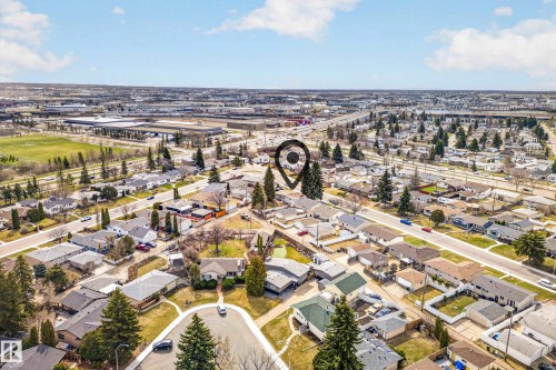 Aerial perspective showcasing a residential neighborhood with varied housing styles - 5304 90A Avenue, Edmonton, AB 