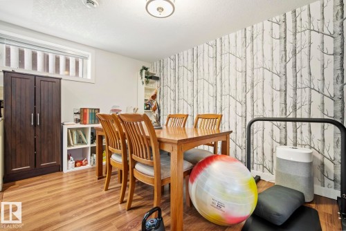 Dining room with feature wall - 10649 67 Avenue, Edmonton, AB - Indoor Photo Showing Dining Room