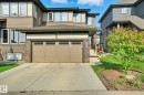 Contemporary two-story exterior with horizontal siding and stone accents - 2039 Wonnacott Way, Edmonton, AB 