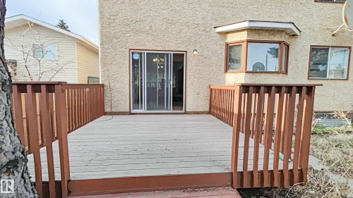 Spacious outdoor wood deck with perimeter railing - 3031 79 Street Nw, Edmonton, AB - Outdoor With Exterior
